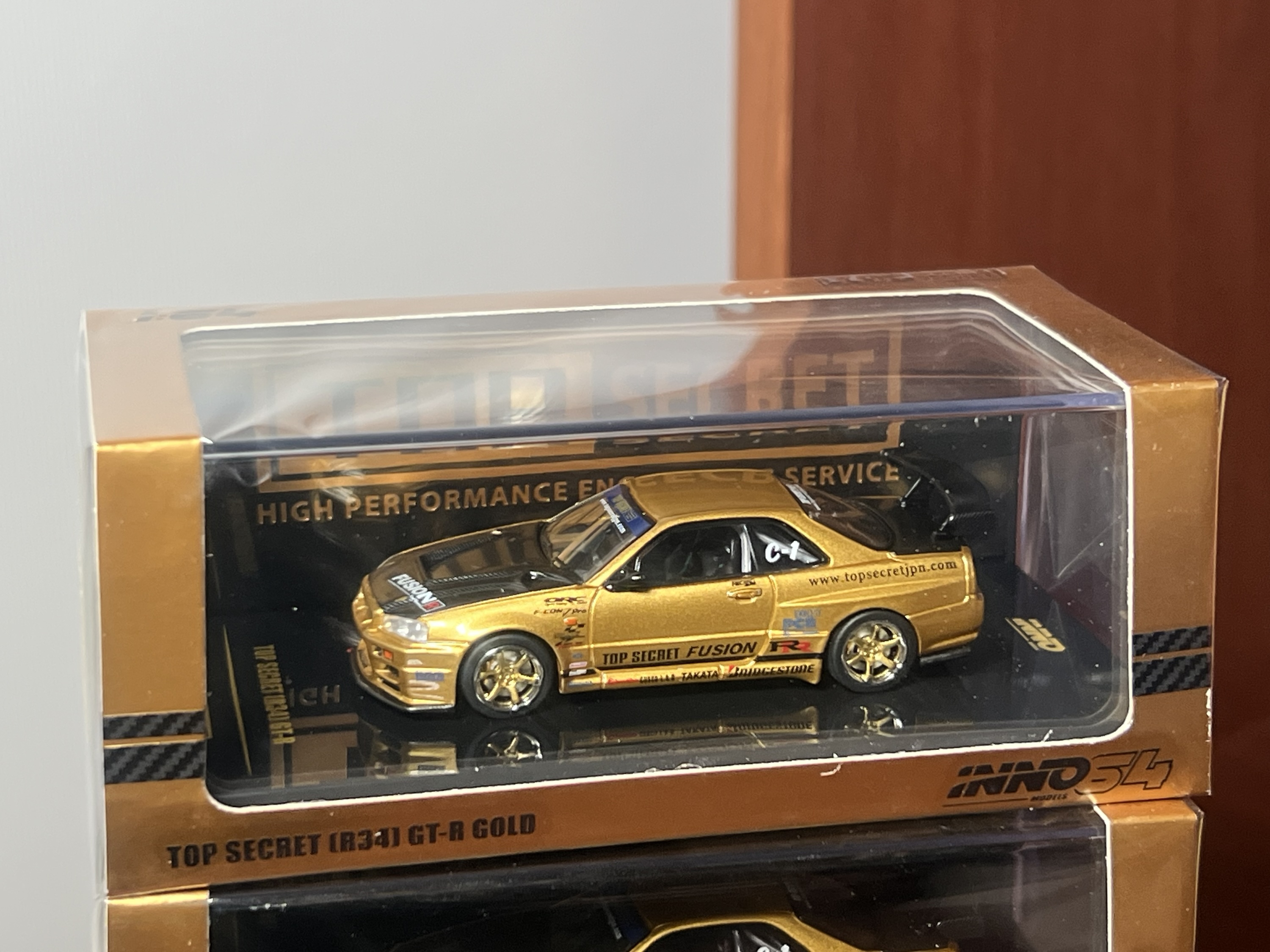 Inno64 Nissan TOP SECRET R34 GT-R Gold