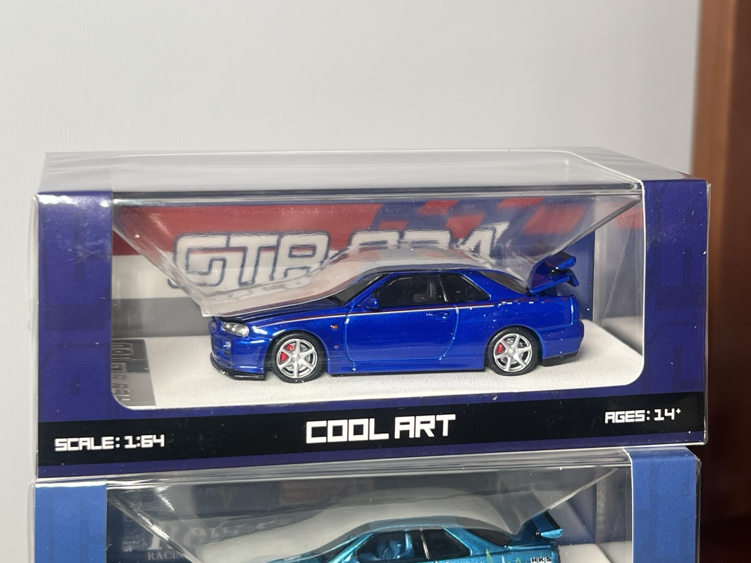 Cool Art 1:64 Nissan Skyline R34 Azul con apertura de capó