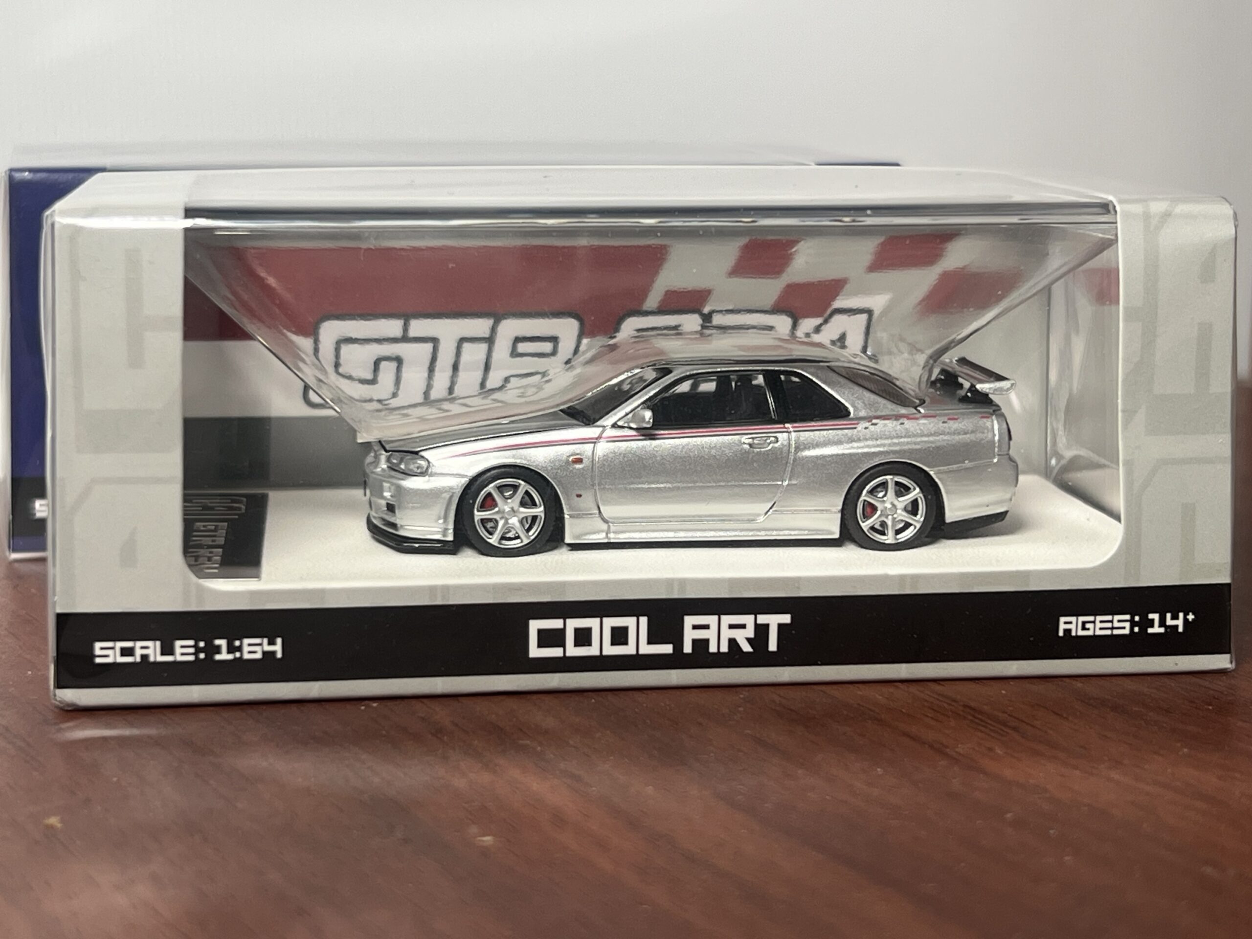 Cool Art 1:64 Nissan Skyline R34 Gris con apertura de capó