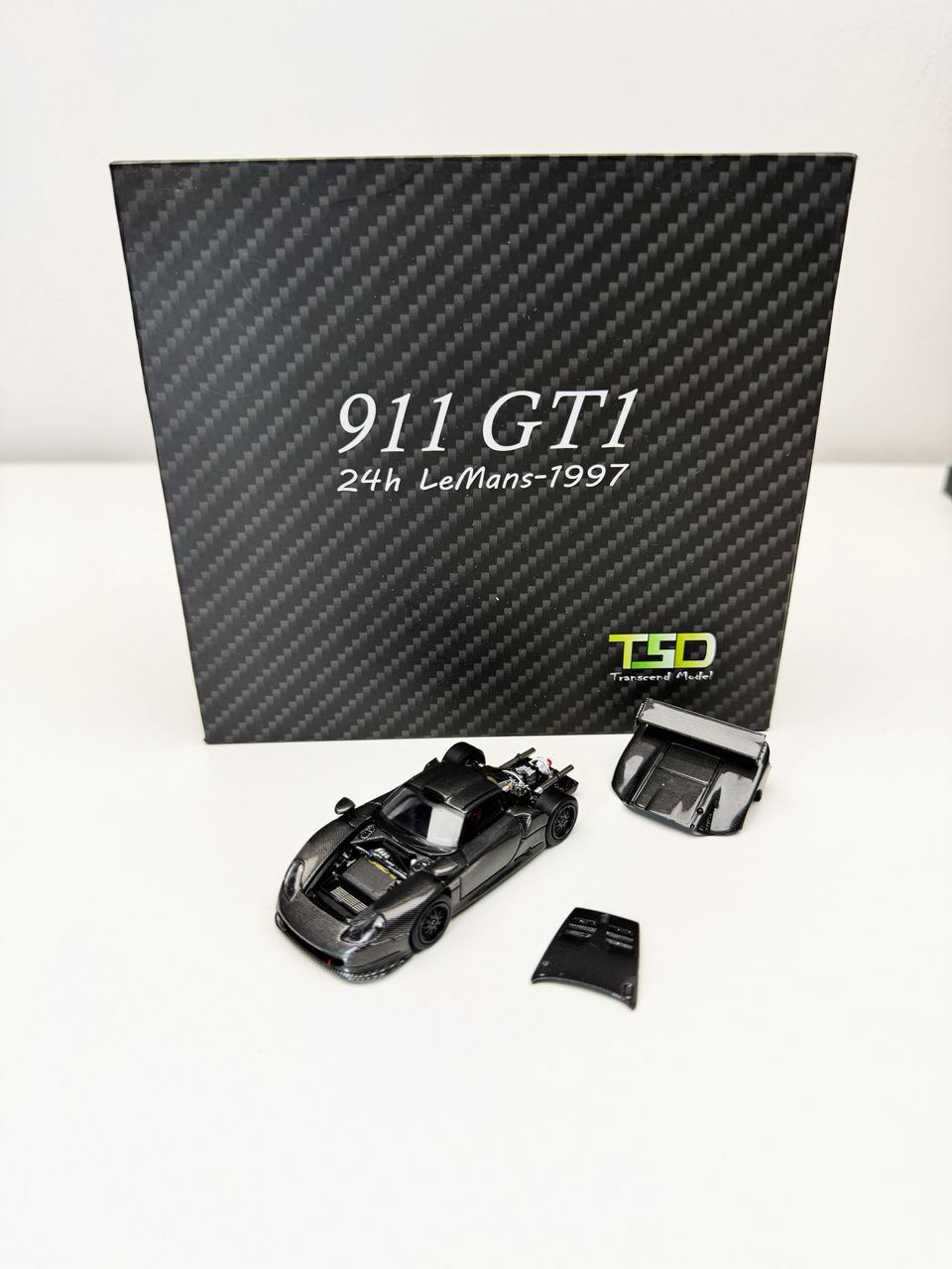 *PREORDEN* Transcend model 1:64 Porsche 911 GT1 24h LeMans 1997 acabado Fibra de Carbono